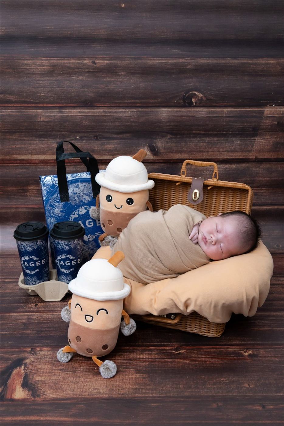 Newborn in a playful bubble-tea themed setup